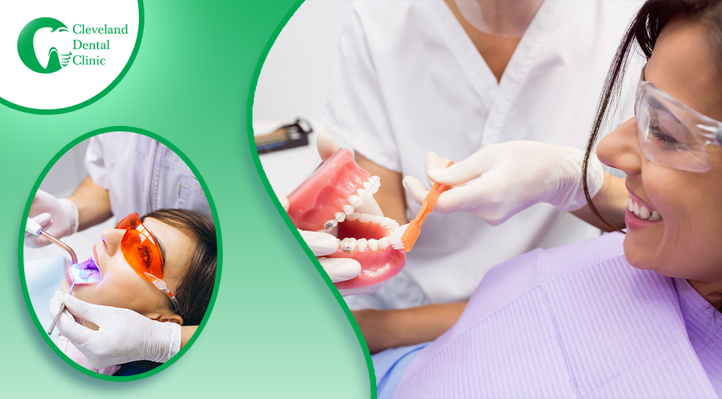 dentist-presenting-on-correct-brushing-over-denture-mold